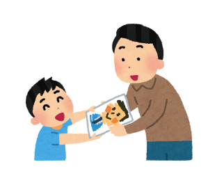似顔絵を渡す子供